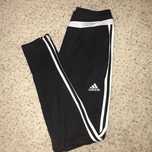 Adidas black stripped joggers.